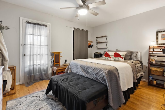 bedroom featuring ceiling fan and light hardwood / wood-style flooring