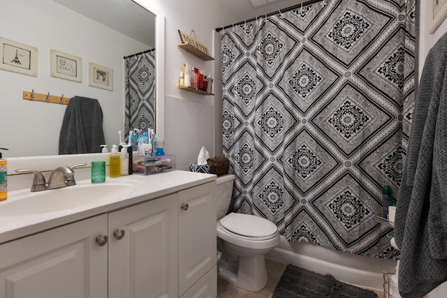 bathroom with vanity, tile patterned flooring, and toilet