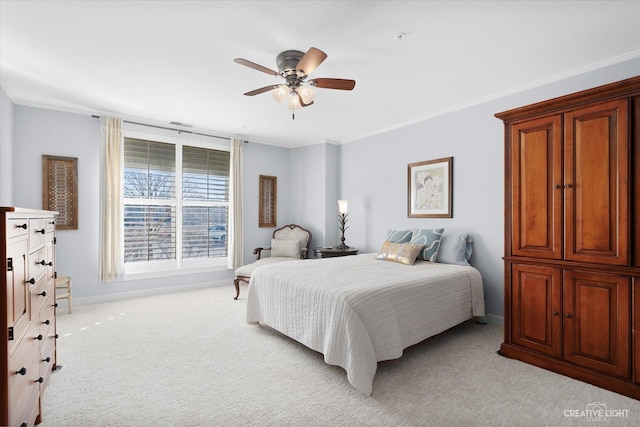 bedroom with light carpet, ornamental molding, and ceiling fan