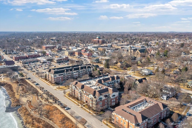 birds eye view of property featuring a water view and a view of the beach