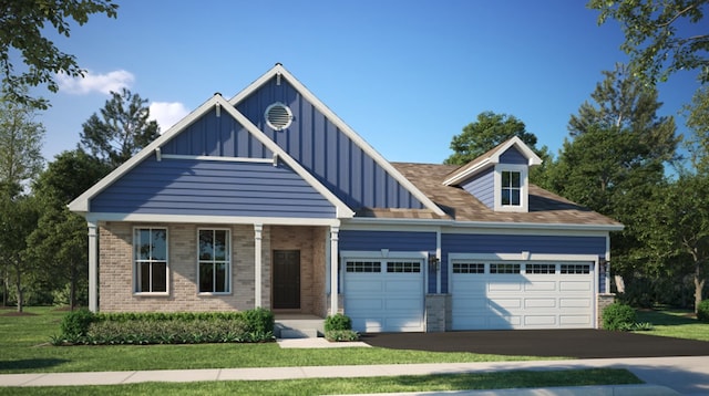 view of front of house with a garage and a front yard