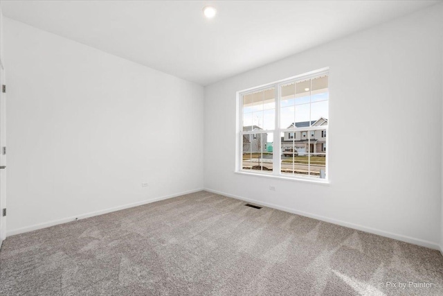 view of carpeted spare room