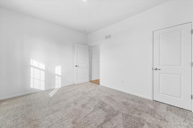 empty room with carpet flooring