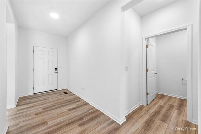 foyer with light hardwood / wood-style floors