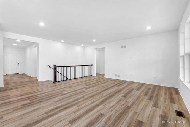 spare room with light wood-type flooring