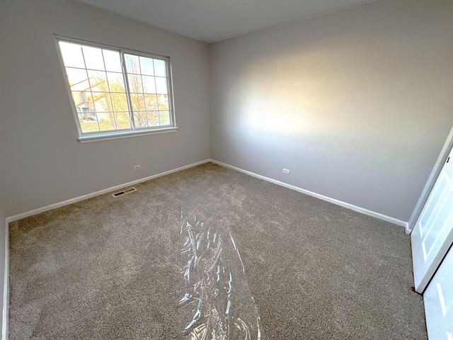 unfurnished room with carpet floors