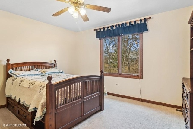 bedroom featuring light colored carpet and ceiling fan