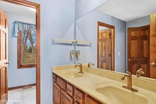 bathroom featuring tile patterned floors and vanity