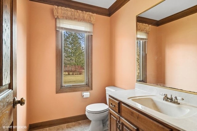 bathroom with vanity, crown molding, tile patterned floors, and toilet