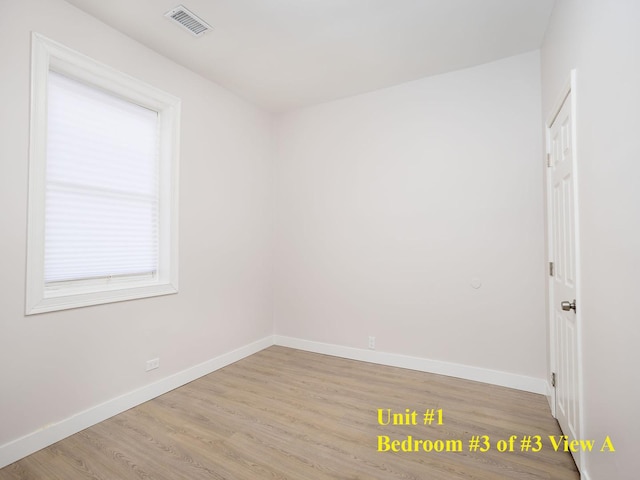 unfurnished room featuring light wood-type flooring