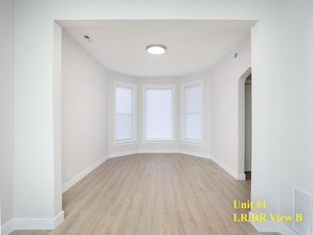 spare room featuring light hardwood / wood-style flooring