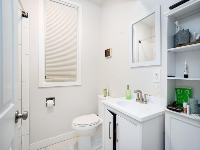 bathroom featuring vanity, toilet, tile patterned flooring, and a shower