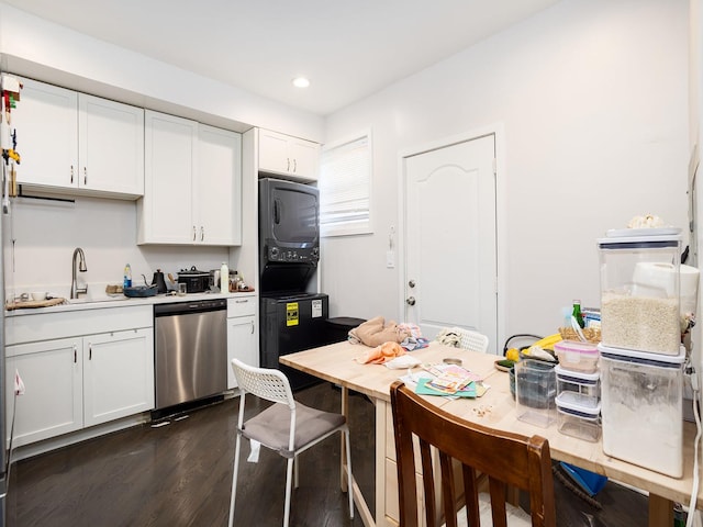 kitchen with sink, white cabinetry, stacked washer / drying machine, dark hardwood / wood-style flooring, and stainless steel dishwasher