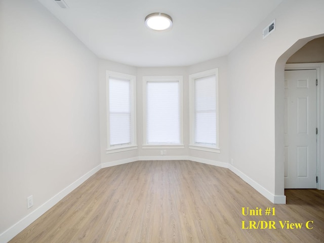 spare room featuring light wood-type flooring