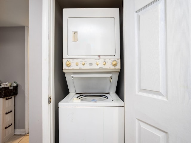 washroom with stacked washer and dryer