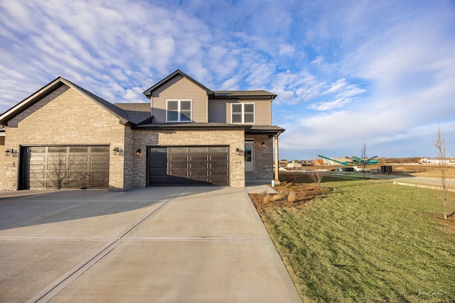 view of front of property with a garage and a front lawn