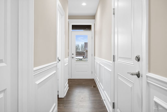 corridor with dark wood-type flooring