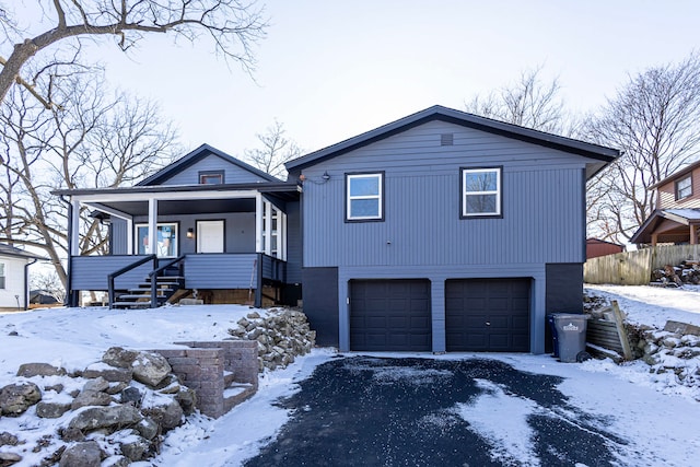 view of front of home with a garage and covered porch