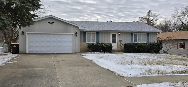 single story home with a garage, brick siding, driveway, and a shingled roof