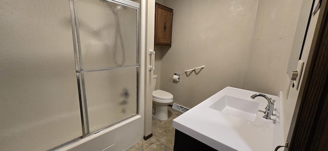 bathroom with toilet, bath / shower combo with glass door, visible vents, and vanity