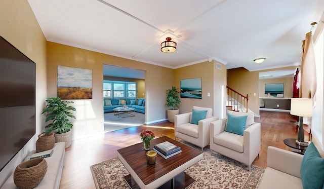 living room featuring crown molding and wood-type flooring