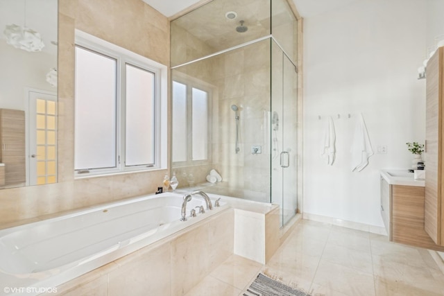 bathroom with vanity, a wealth of natural light, and plus walk in shower