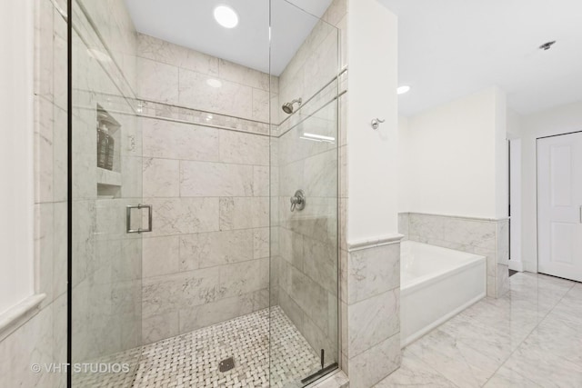 bathroom featuring plus walk in shower