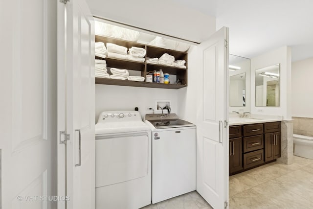 clothes washing area featuring washer and clothes dryer