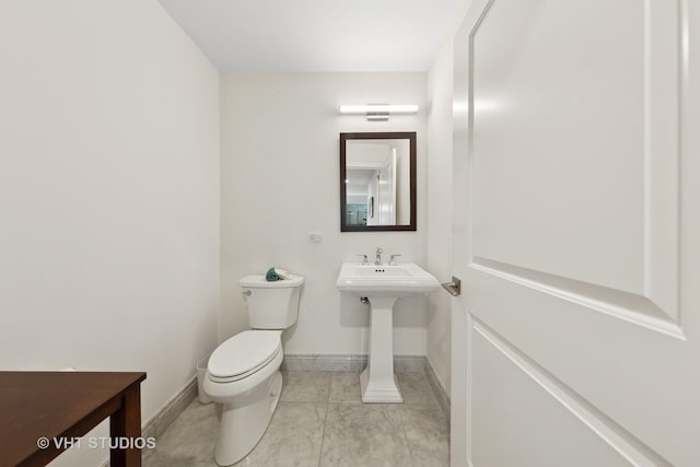 bathroom with sink and toilet