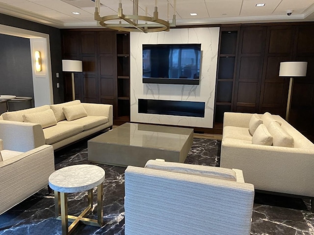 living room featuring crown molding and a fireplace