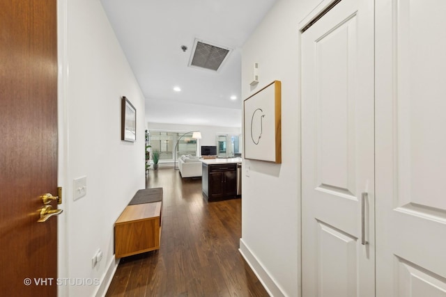 hallway with dark hardwood / wood-style flooring