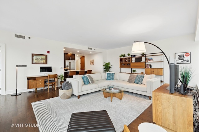 living room featuring dark hardwood / wood-style floors