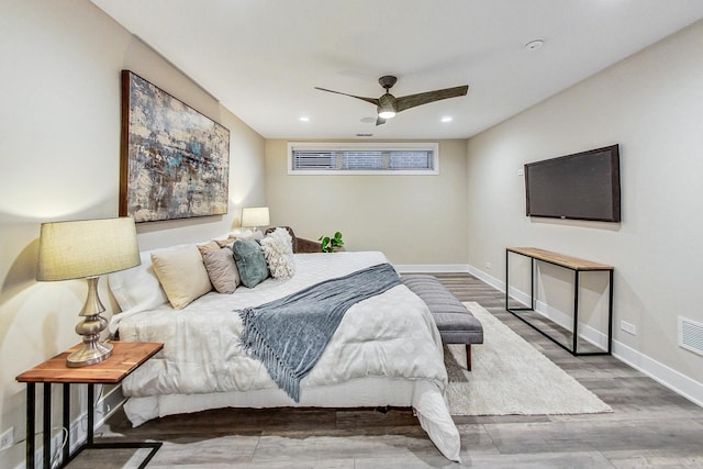 bedroom featuring hardwood / wood-style flooring and ceiling fan