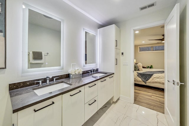 bathroom with vanity and ceiling fan