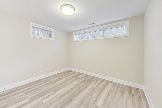 unfurnished room featuring light hardwood / wood-style floors