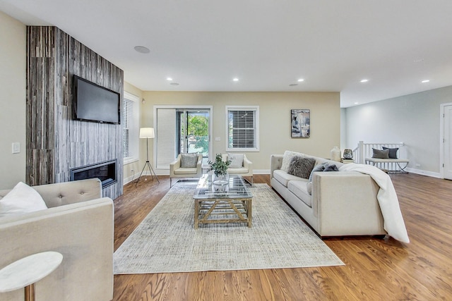 living room featuring hardwood / wood-style flooring and a fireplace