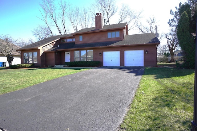 view of front facade featuring a garage and a front yard