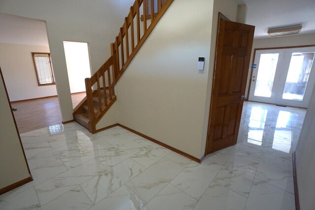 staircase featuring french doors