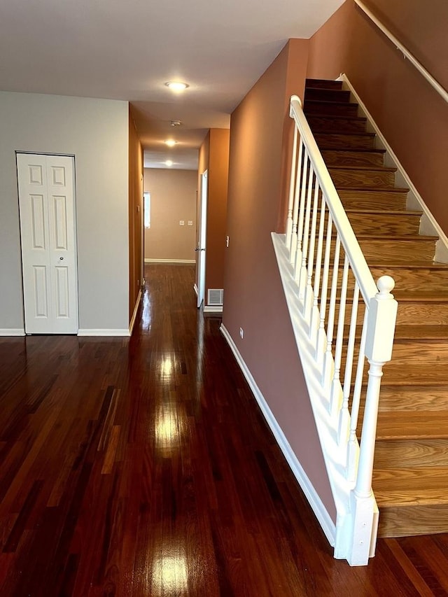 hallway featuring dark hardwood / wood-style flooring