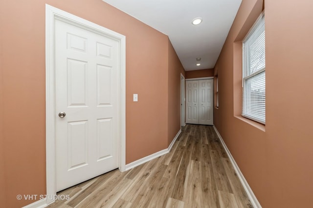 hall with light wood-type flooring