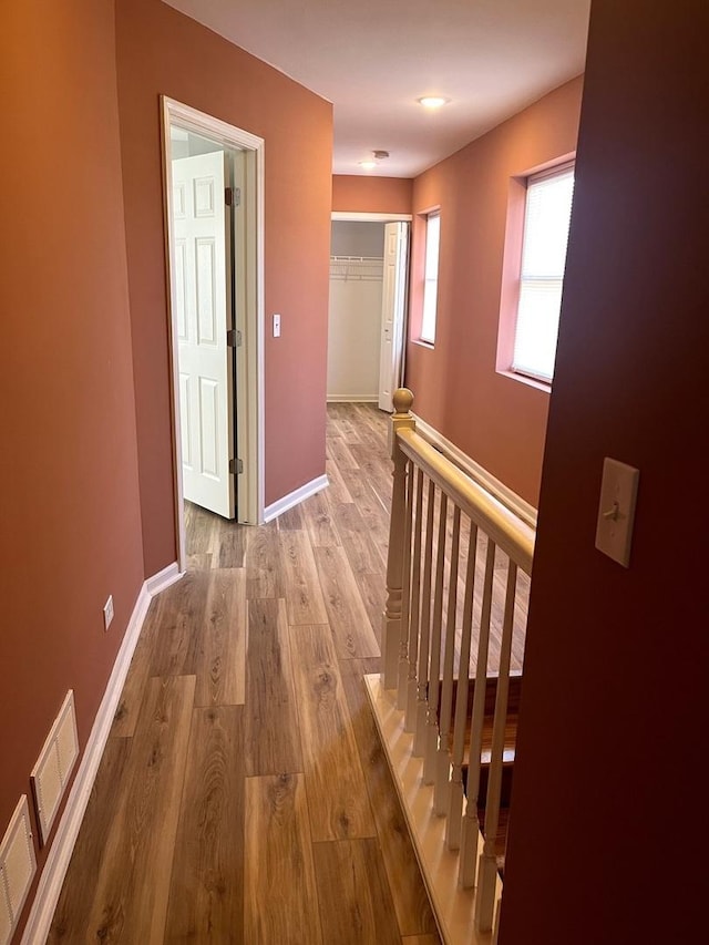 hallway with light wood-type flooring