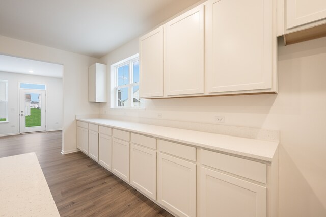 kitchen featuring white cabinetry, plenty of natural light, and dark hardwood / wood-style floors