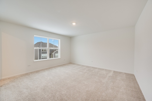 spare room with light colored carpet