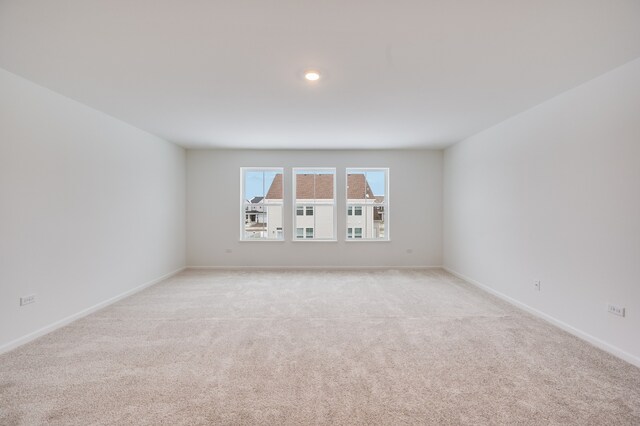 empty room with light colored carpet