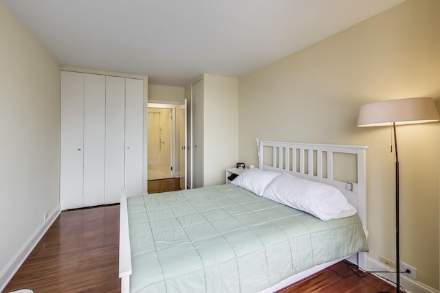 bedroom featuring hardwood / wood-style flooring and a closet