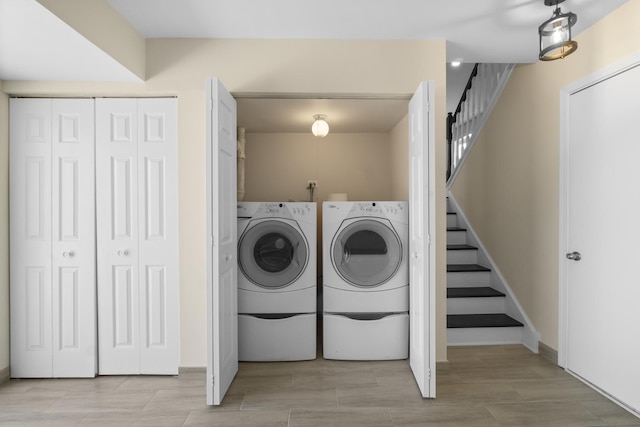 laundry room featuring washing machine and dryer