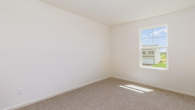 spare room with carpet flooring