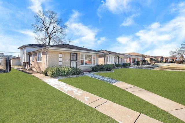 ranch-style house with a front yard