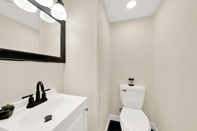 bathroom with vanity and toilet