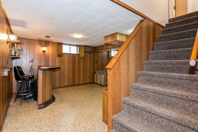 stairway with wooden walls